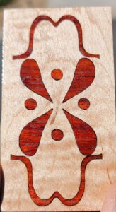 Revised endpiece designed and inlayed.